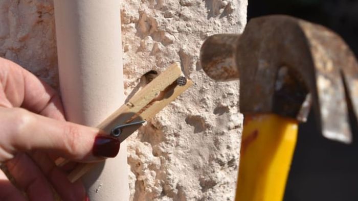 clothespin holding nail