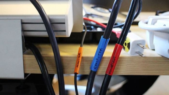 Electronic cords neatly organized with labeled straws.