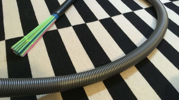 A vacuum cleaner featuring a straw-made attachment.