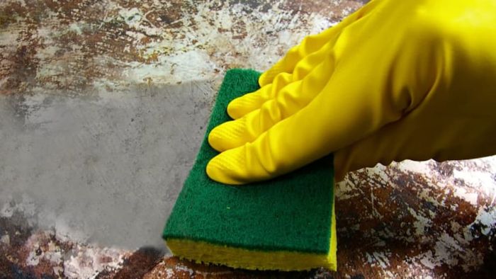 hand scrubbing a pan