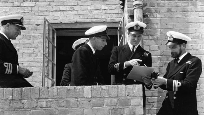 Lieutenant Philip Mountbatten, prior to his marriage to Princess Elizabeth, talking to a group of Naval officers on his return to Royal Navy duties, at the Petty Officers Training Centre in Corsham, Wiltshire, July 31st, 1947.