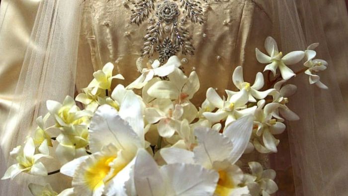 Princess Elizabeth's wedding dress, designed by Norman Hartnell, was showcased at the 'Royal Wedding: 20 November 1957' exhibition at Buckingham Palace on July 27, 2007, in London.