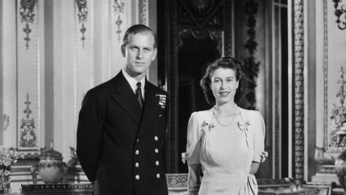 Princess Elizabeth (who would later become Queen Elizabeth II) and her fiancé, Philip Mountbatten (the Duke of Edinburgh), pose for a photo at Buckingham Palace on July 9, 1947, the day their engagement was officially announced.