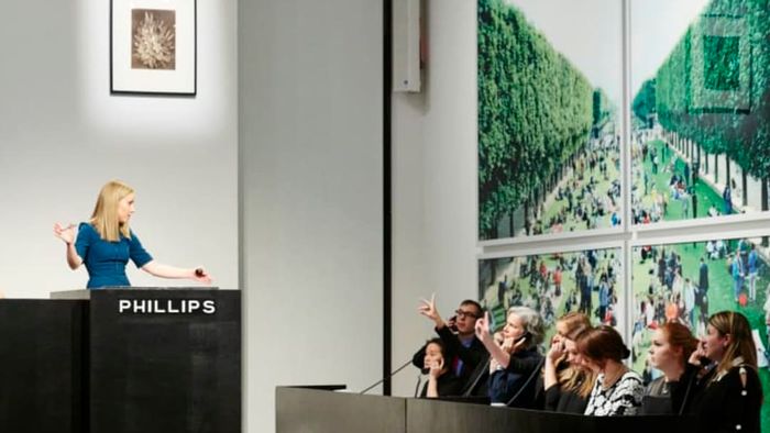 Auctioneer Sarah Krueger leads a sale for Phillips.