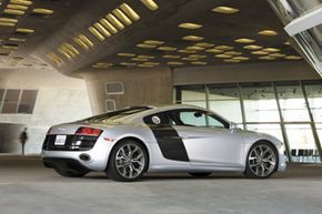 The Audi R8 features striking side blades, which are carbon fiber panels that run directly behind the passenger doors.