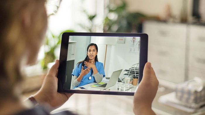 doctor consulting patient through video call