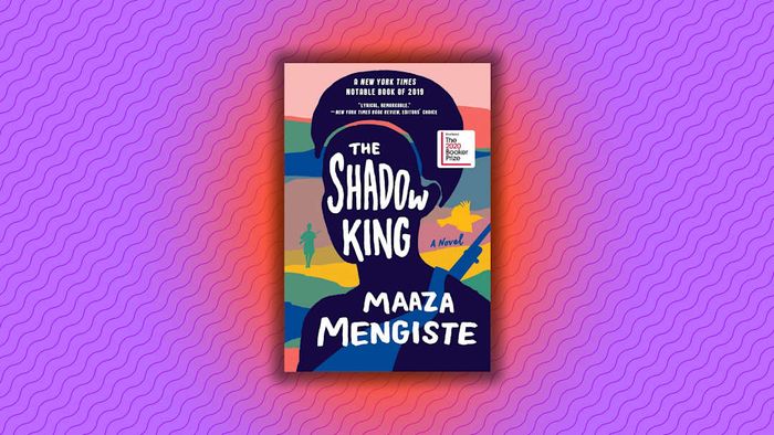A purple background featuring the cover of ‘The Shadow King.’