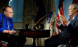 Larry King engages in a conversation with former Defense Secretary Donald Rumsfeld