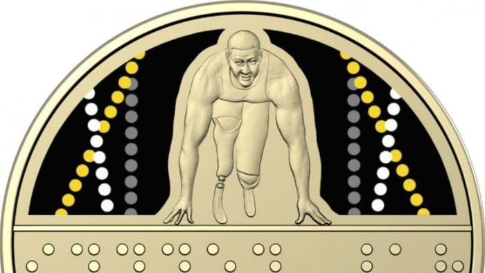 A commemorative coin for the Invictus Games includes Braille text