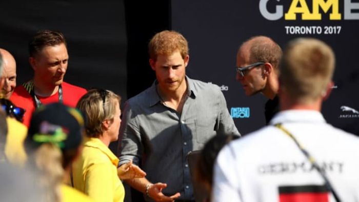Prince Harry engages in conversation with representatives at the Invictus Games