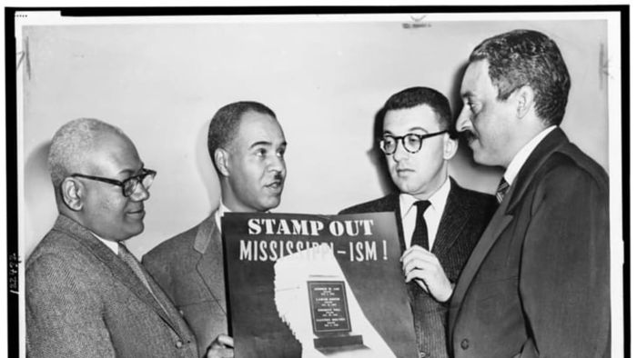Marshall (far right) stood alongside other NAACP leaders, holding an NAACP sign. From left to right: Henry L. Moon, director of public relations; Roy Wilkins, executive secretary; and Herbert, labor secretary.