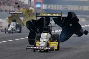 To decelerate after a high-speed run, Top Fuel dragsters deploy two parachutes.