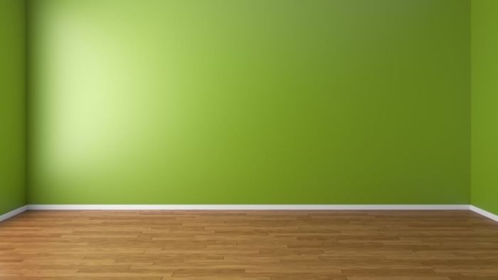 A vacant room with green-colored walls.