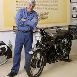 Jay Leno posing with a Vincent Black Shadow.