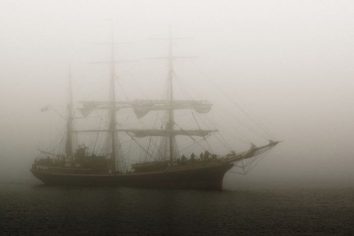 A ghostly ship floating on water