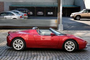 A Tesla Roadster electric vehicle is seen parked on a New York street on February 19, 2009. Regardless of Tesla’s future, the Roadster provides a preview of the electric direction the auto industry is increasingly heading toward.