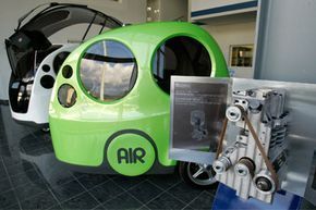 A compressed-air engine is displayed alongside 