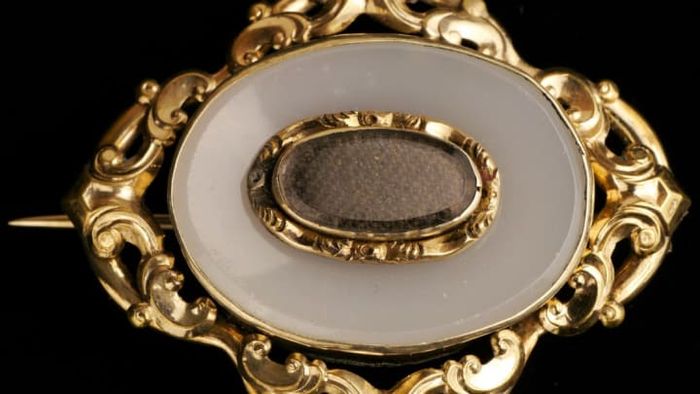 A Victorian mourning brooch crafted from human hair