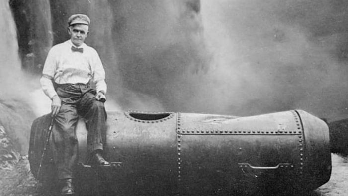 Bobby Leach stands proudly with his barrel following his daring descent over Niagara Falls on July 25, 1911.