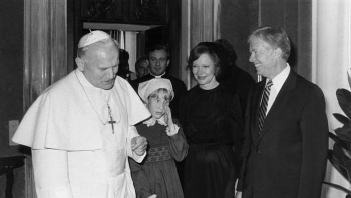 Pope John Paul II greets President Jimmy Carter and his family during their meeting in 1976.