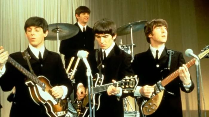 The Beatles rocking the stage in 1963.
