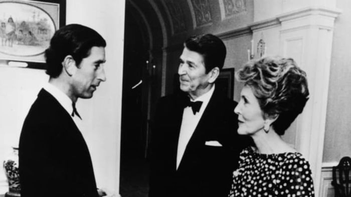 Prince Charles conversing with President Ronald Reagan and First Lady Nancy during a private dinner at the White House in 1981.
