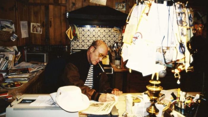 Hunter S. Thompson seated at his desk in April 1996.