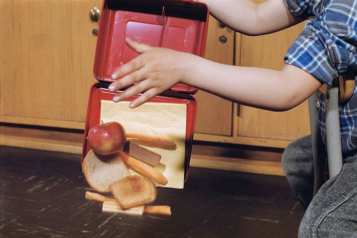 Boy Spilling Lunchbox Contents
