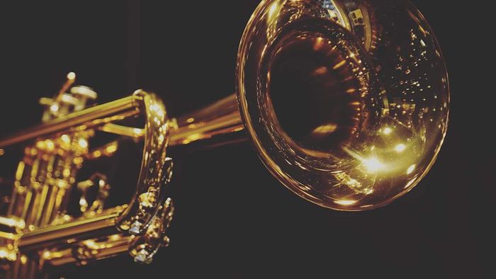 A trumpet set against a dark background