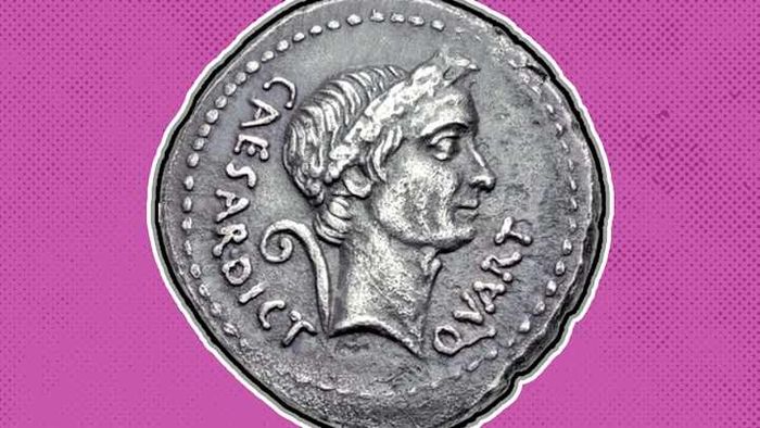 A coin from ancient Rome features the likeness of Julius Caesar.