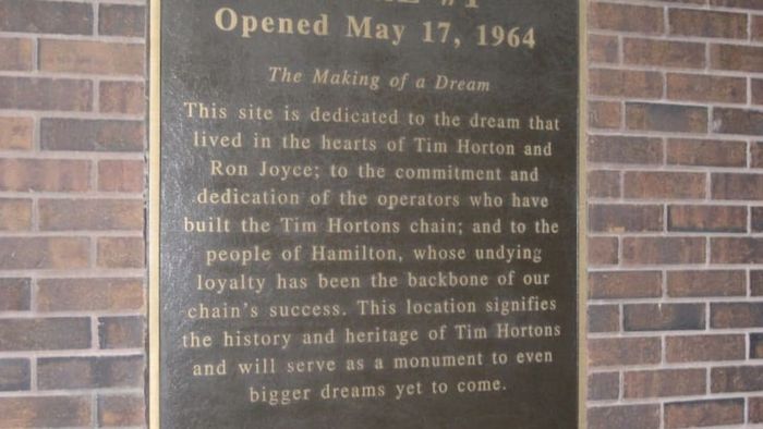 A commemorative plaque marks the location of the first Tim Hortons store.
