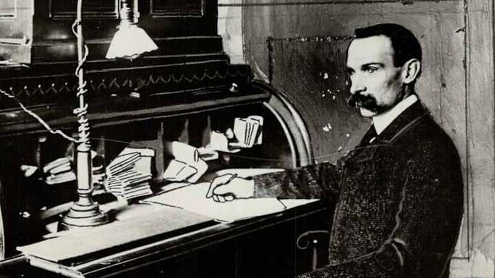 Ambrose Small seated in his office.