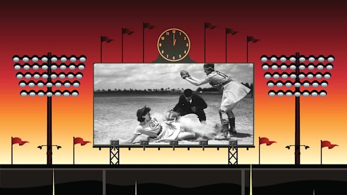 In a 1948 game, Marge Callaghan from the Fort Wayne Daisies makes a dramatic slide into home plate.