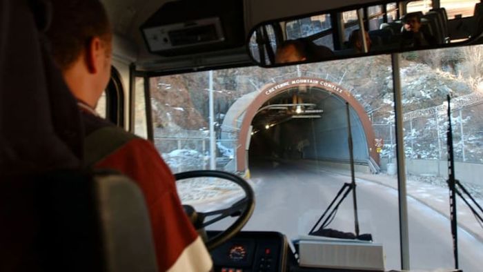 A vehicle enters the tunnel leading into Cheyenne Mountain.
