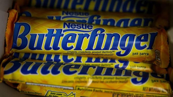 A box filled with several Butterfinger candy bars.