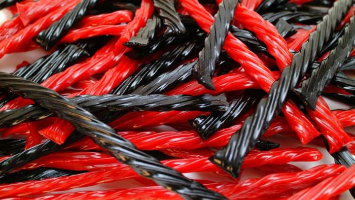 A stack of black and red Twizzlers.