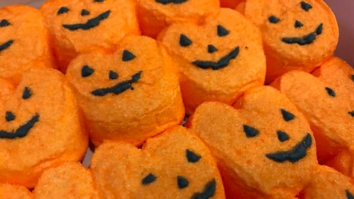 A tray filled with pumpkin-shaped Peeps.