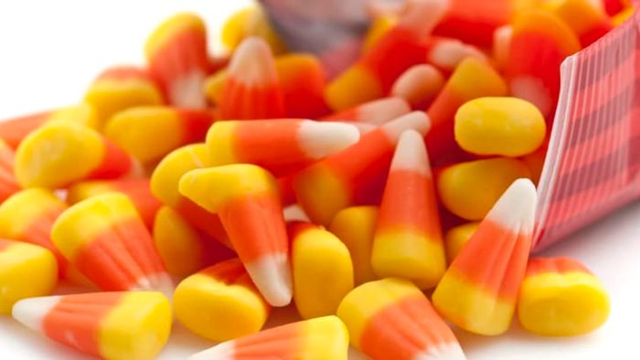 A bag of candy corn that has been opened.