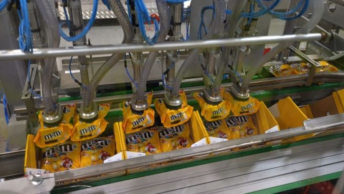 A machine packaging M&M's candies at a Mars production facility in France.