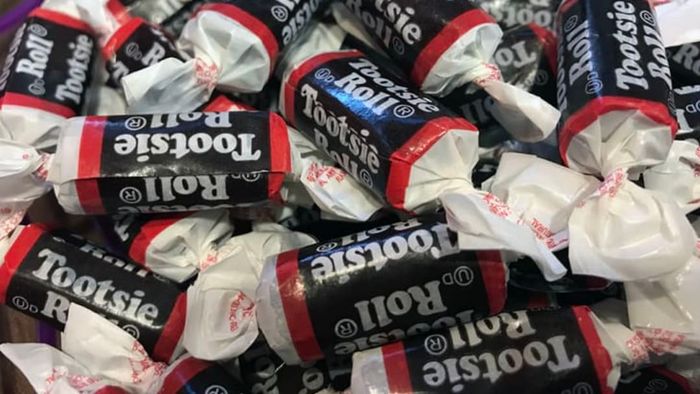 A detailed close-up shot of a collection of Tootsie Rolls.