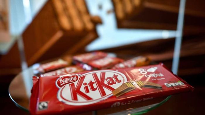 A Kit Kat bar wrapped in red packaging.