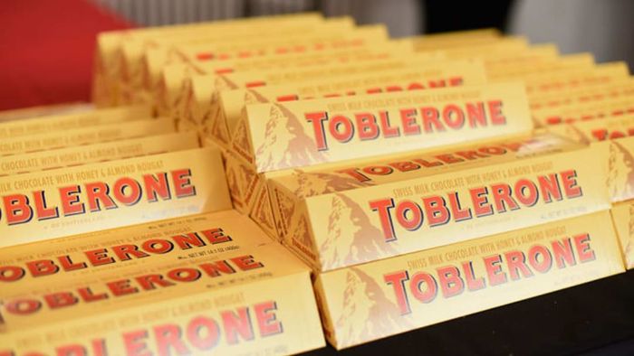 Boxes of Toblerone chocolates neatly piled up.