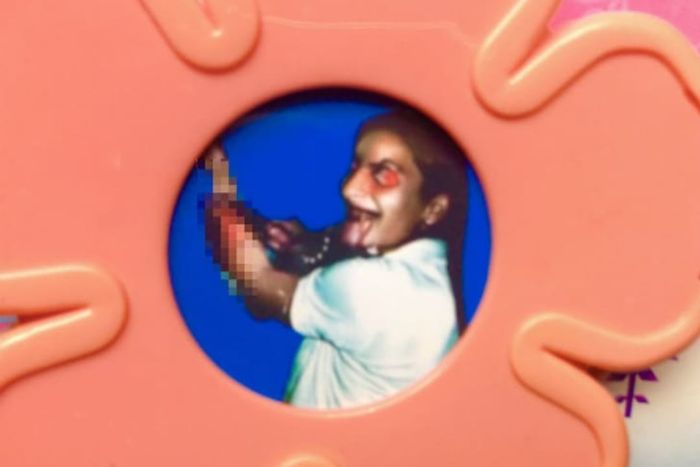 A detailed view of the Evilstick’s concealed image depicting a demonic woman slashing her wrists.