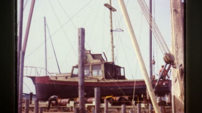 The Orca II is pictured out of the water, with the barrels used to sink and raise it clearly visible beneath.