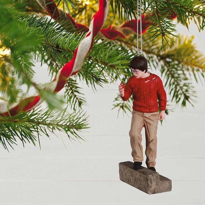Christmas ornament depicting Harry Potter holding the Sorcerer's Stone