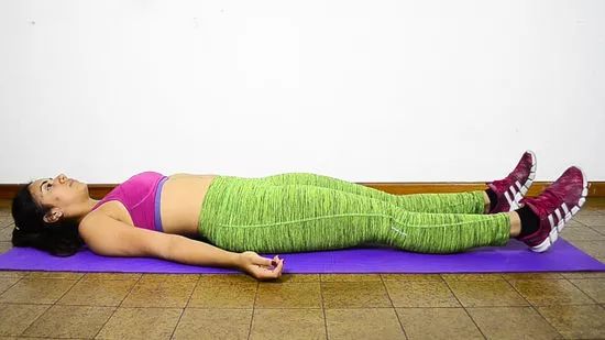 Step 1: Begin by lying on your back with arms at your sides.