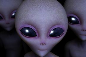 An artist's representation shows a close-up of three purple aliens.