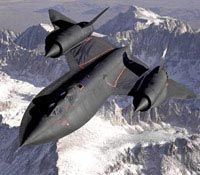 An SR-71 Blackbird glides through the air, framed by a backdrop of majestic, snow-topped mountains.