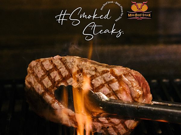 Moo Beef Steak Hanoi ảnh 1 - Góc nhìn đầu tiên về không gian sang trọng với những bàn tiệc được bày biện tinh tế, nơi nghệ thuật ẩm thực đạt đến độ hoàn mỹ.