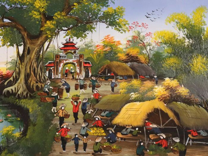 Hình ảnh minh họa: Khoảnh khắc gia đình gói bánh chưng ngày Tết